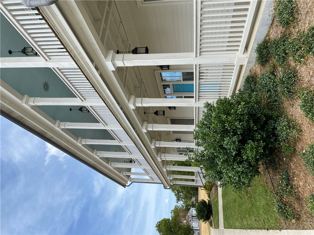 208 West 22nd Street, Unit B Bryan, TX 77803 - Photo 15 of 15 a front view of a house with a yard