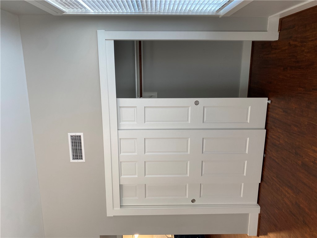 208 West 22nd Street, Unit B Bryan, TX 77803 - Photo 9 of 15 an empty room with wooden floor and closet