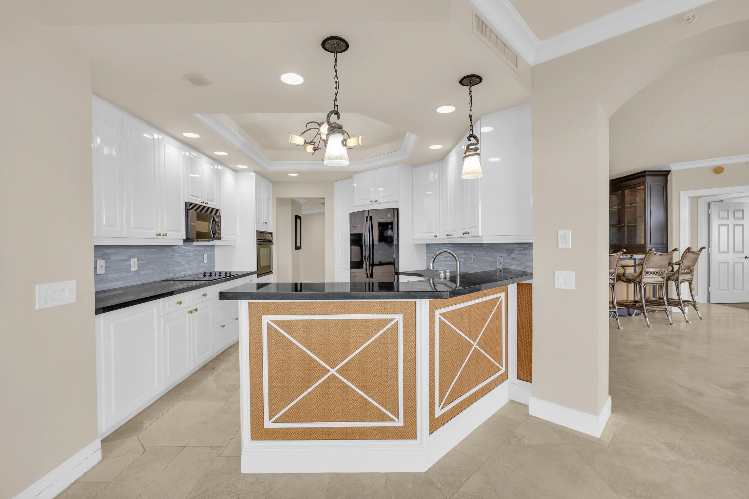 340 South US Highway 1, Unit 408 Jupiter, FL 33477 - Photo 12 of 53 a kitchen with stainless steel appliances granite countertop a sink cabinets and wooden floor