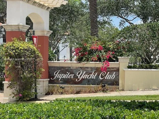 a view of outdoor space with signage and flags