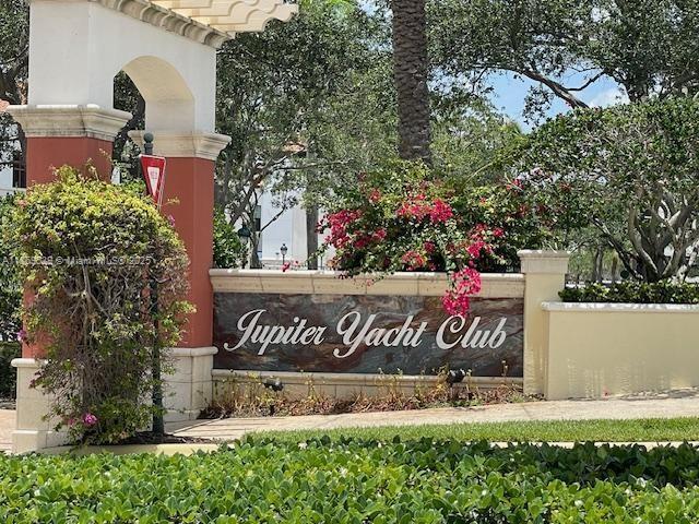 340 South US Highway 1, Unit 408 Jupiter, FL 33477 - Photo 2 of 53 a view of outdoor space with signage and flags