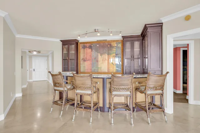 an empty room with ceiling fan and window