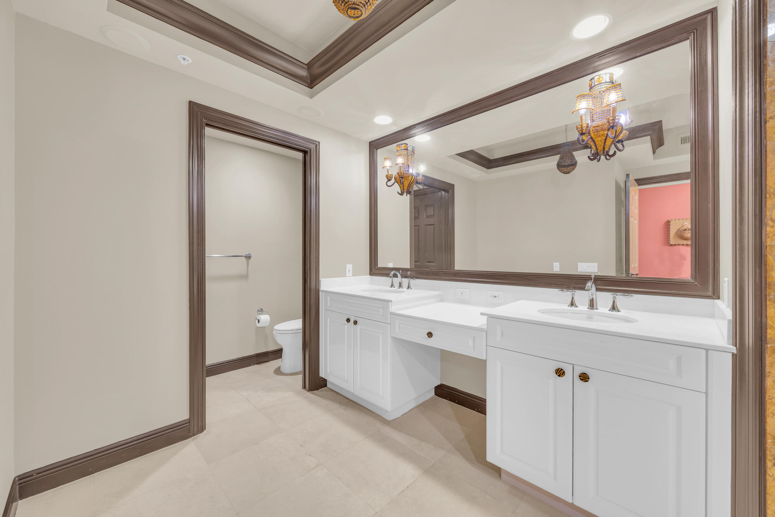 340 South US Highway 1, Unit 408 Jupiter, FL 33477 - Photo 34 of 53 a bathroom with a double vanity sink and a mirror