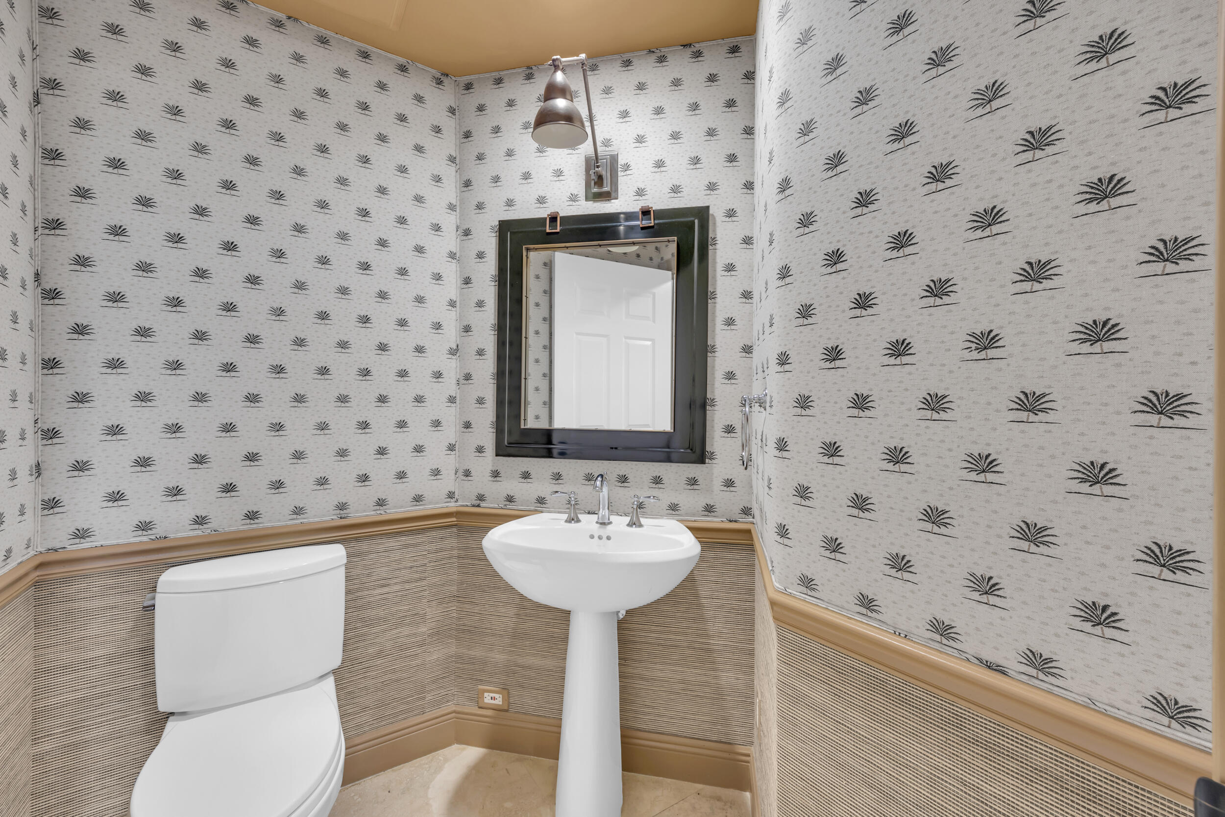 340 South US Highway 1, Unit 408 Jupiter, FL 33477 - Photo 46 of 53 a bathroom with a sink toilet and a mirror