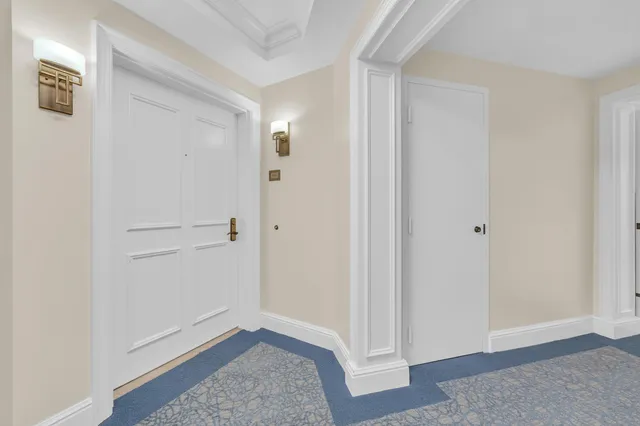 a large kitchen with cabinets a sink and appliances