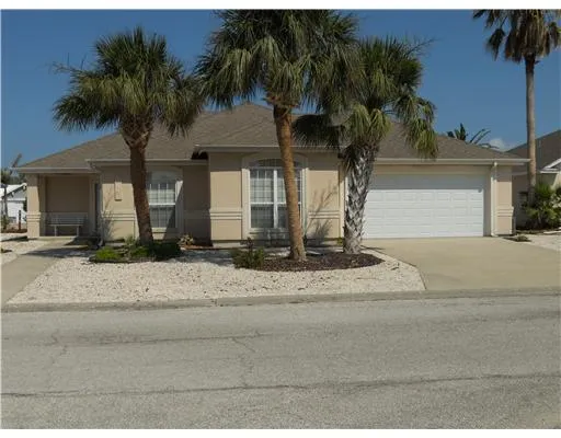 a front view of house with garage and yard