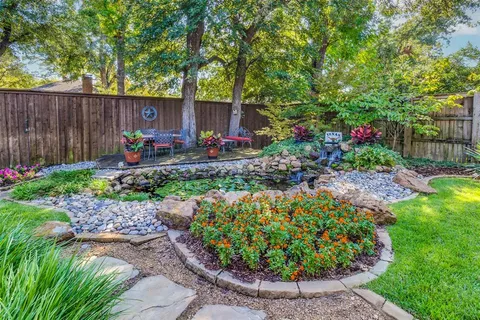a view of a backyard with sitting area