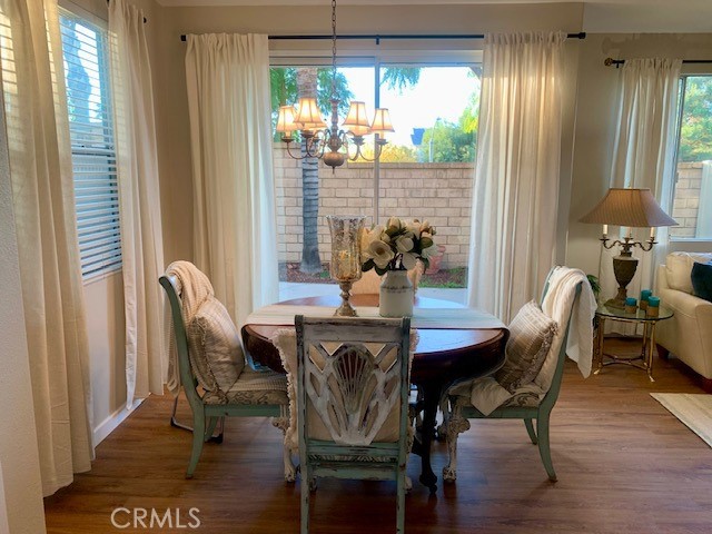 39213 Anchor Bay, Unit B Murrieta, CA 92563 - Photo 11 of 48 a view of a dining room with furniture window and outside view