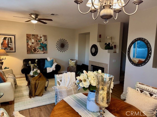 39213 Anchor Bay, Unit B Murrieta, CA 92563 - Photo 12 of 48 a living room with furniture a chandelier and a mirror