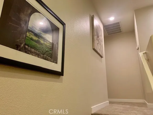 a view of a hallway with storage