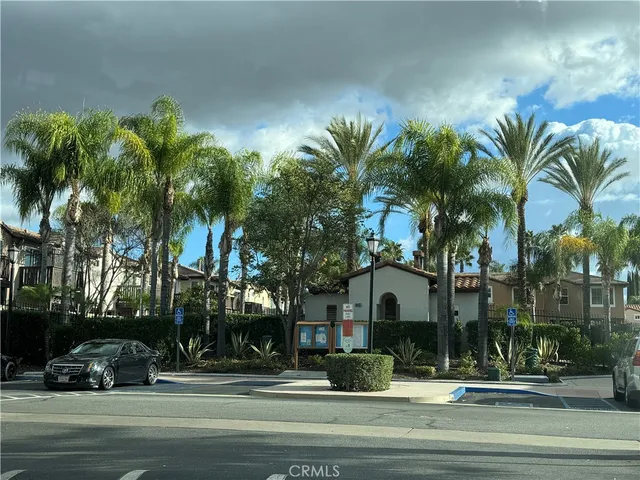 a building with palm trees in front of it