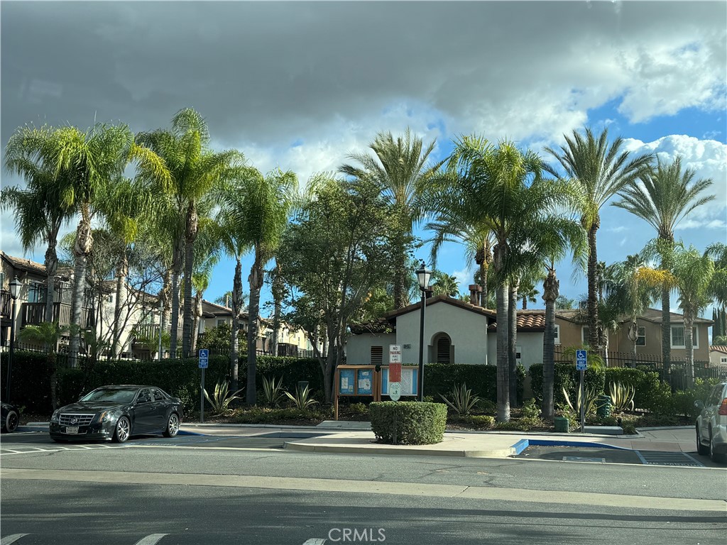 39213 Anchor Bay, Unit B Murrieta, CA 92563 - Photo 2 of 48 a building with palm trees in front of it