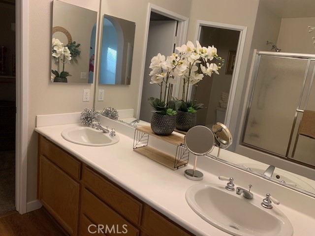 39213 Anchor Bay, Unit B Murrieta, CA 92563 - Photo 26 of 48 a bathroom with a sink and a mirror