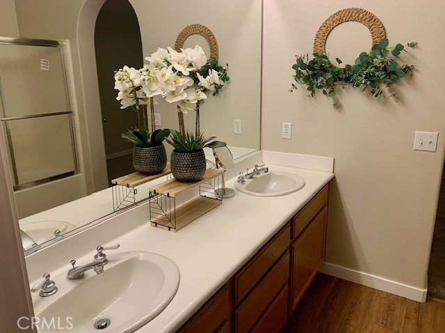 39213 Anchor Bay, Unit B Murrieta, CA 92563 - Photo 27 of 48 a bathroom with a sink double vanity and a mirror