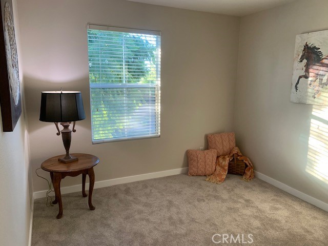 39213 Anchor Bay, Unit B Murrieta, CA 92563 - Photo 38 of 48 a room with furniture and a window