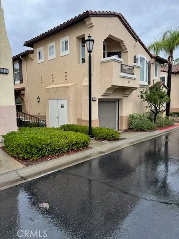 a living room with furniture fireplace and wooden floor