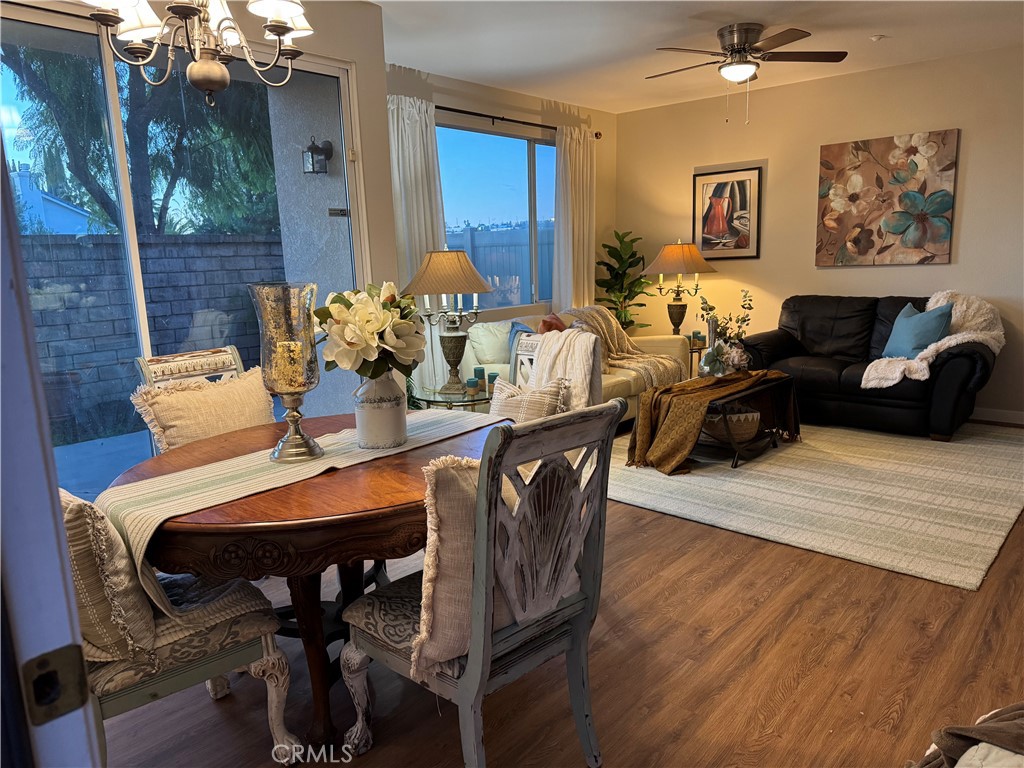 39213 Anchor Bay, Unit B Murrieta, CA 92563 - Photo 7 of 48 a view of a dining room with furniture and wooden floor