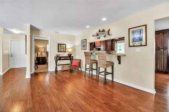 a view of a livingroom with furniture and wooden floor