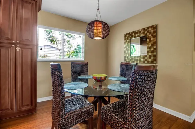 a view of a dining room with furniture window and wooden floor
