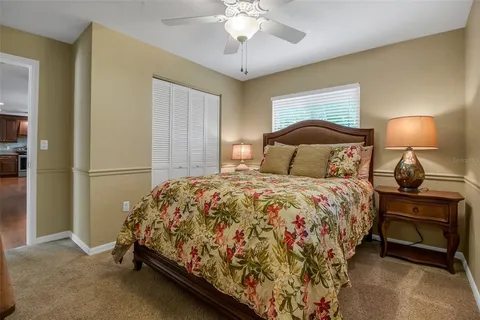 a bedroom with a bed and a lamp