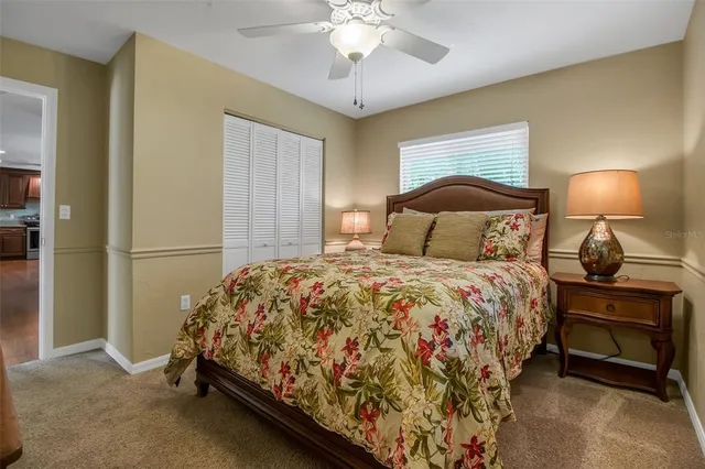 a bedroom with a bed and a lamp