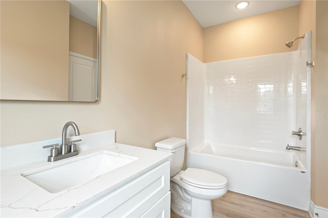 3213 Link Street, Unit 116 Bryan, TX 77801 - Photo 15 of 27 a bathroom with a sink a toilet and shower