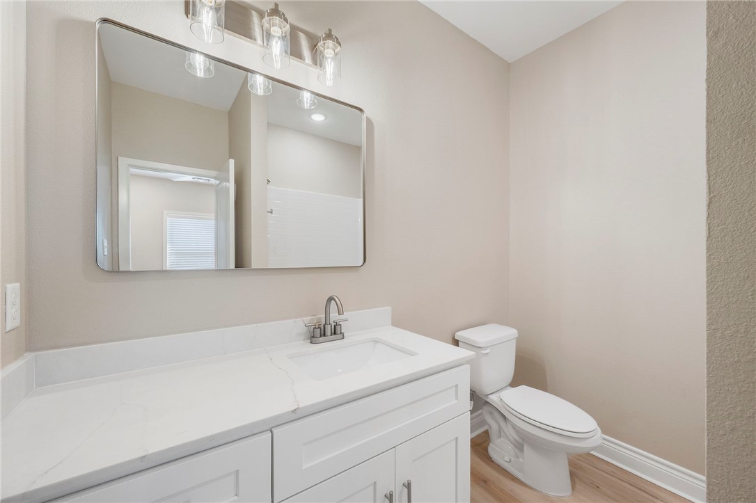 3213 Link Street, Unit 116 Bryan, TX 77801 - Photo 18 of 27 a bathroom with a sink a toilet and mirror