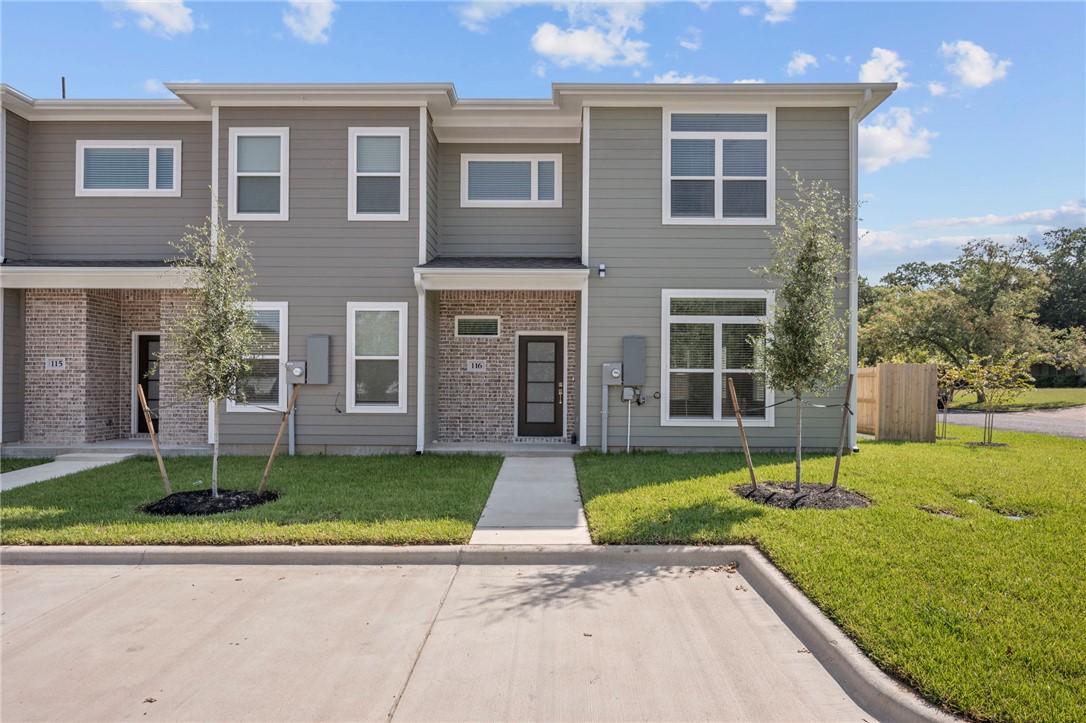 3213 Link Street, Unit 116 Bryan, TX 77801 - Photo 2 of 27 a front view of a house with garden