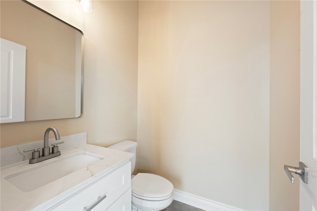3213 Link Street, Unit 116 Bryan, TX 77801 - Photo 21 of 27 a bathroom with a sink a toilet and mirror