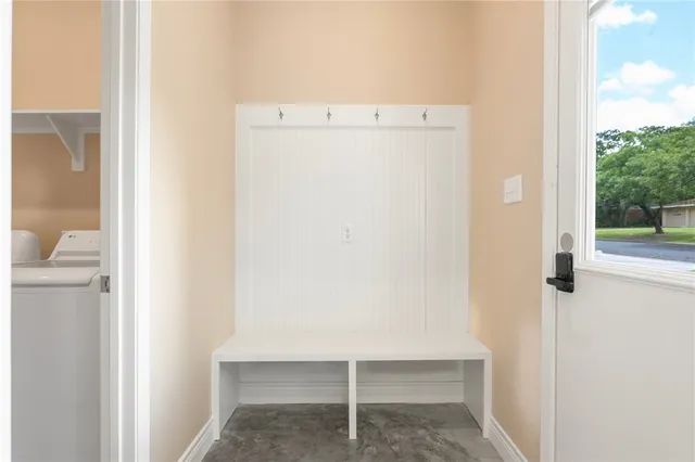 an aerial view of a house with swimming pool patio and outdoor seating