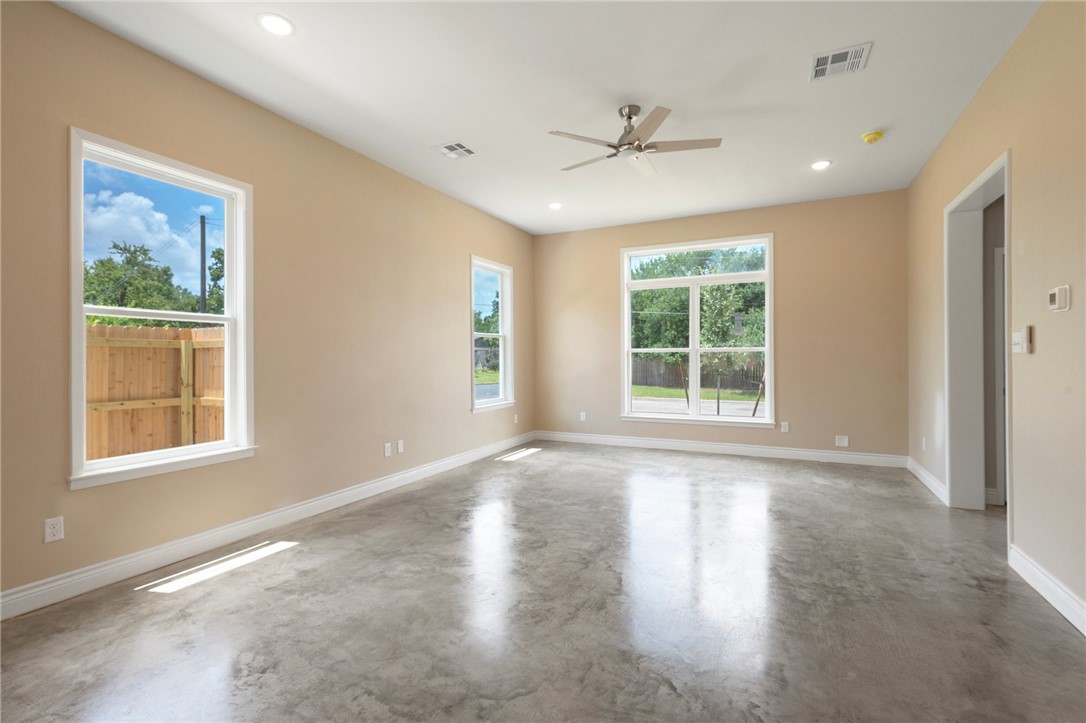 3213 Link Street, Unit 116 Bryan, TX 77801 - Photo 4 of 27 a view of an empty room with a window and wooden floor