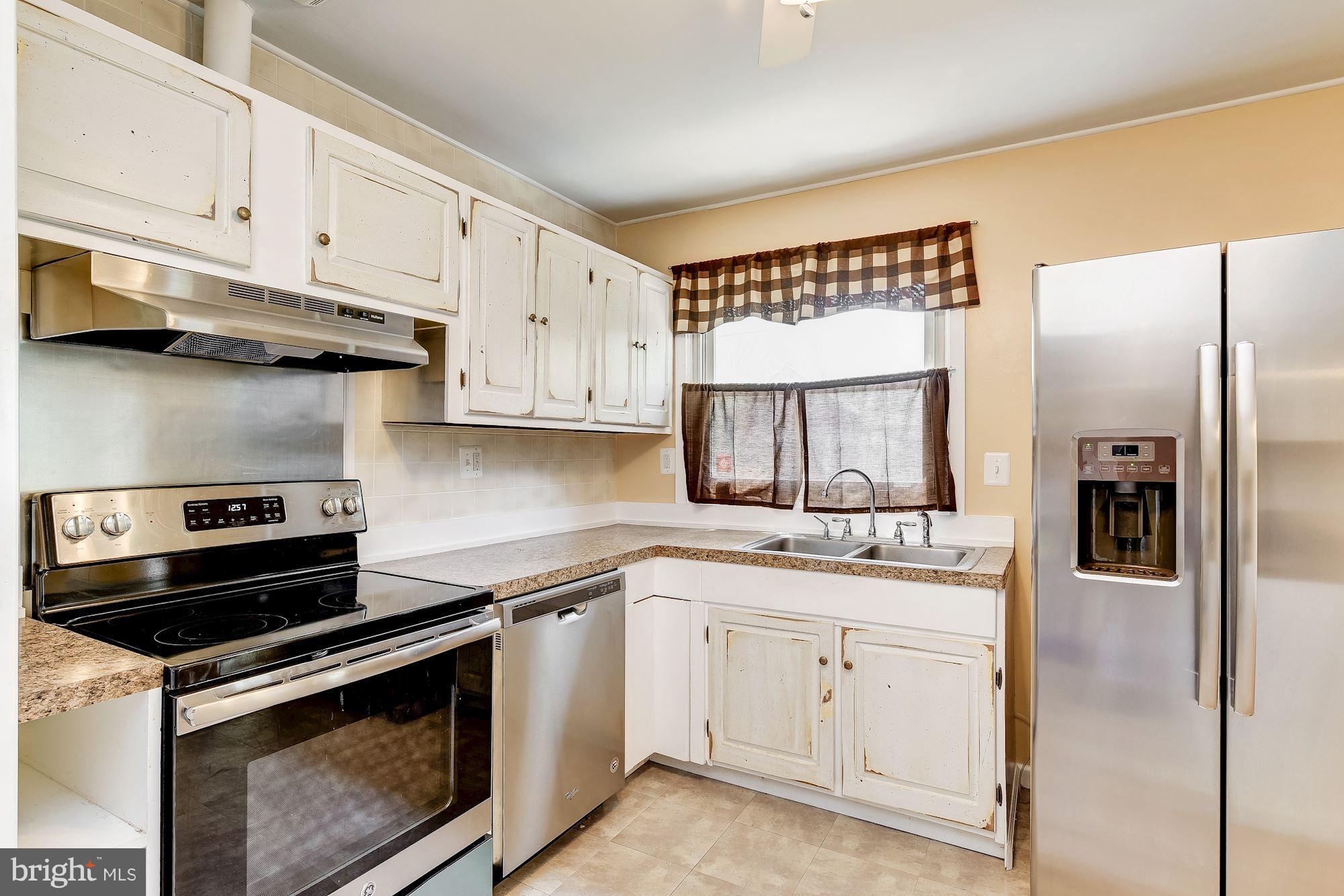 1909 Hanson Road Edgewood, MD 21040 - Photo 11 of 29 a kitchen with white cabinets and appliances