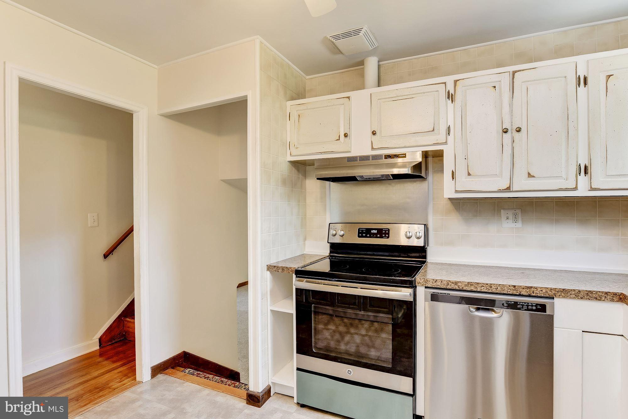 1909 Hanson Road Edgewood, MD 21040 - Photo 12 of 29 a kitchen with stainless steel appliances white cabinets and a stove top oven