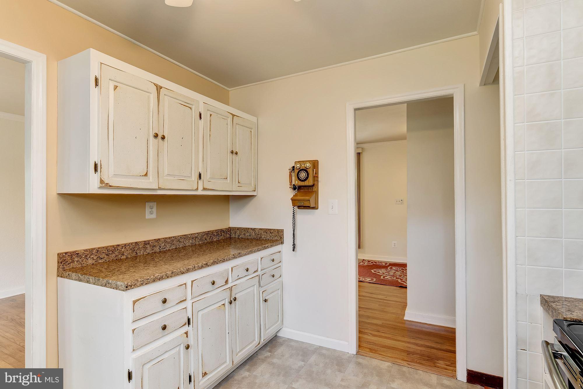 1909 Hanson Road Edgewood, MD 21040 - Photo 13 of 29 a kitchen with granite countertop white cabinets and stainless steel appliances