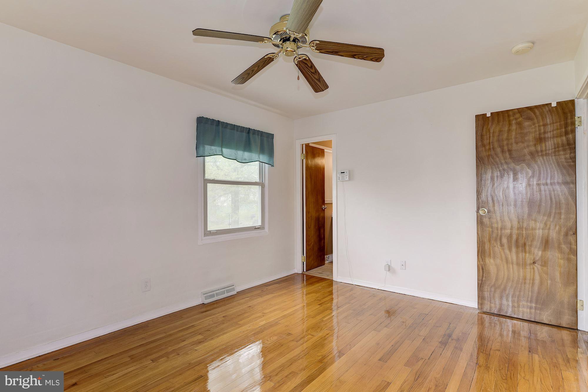 1909 Hanson Road Edgewood, MD 21040 - Photo 15 of 29 a view of empty room with wooden floor and fan