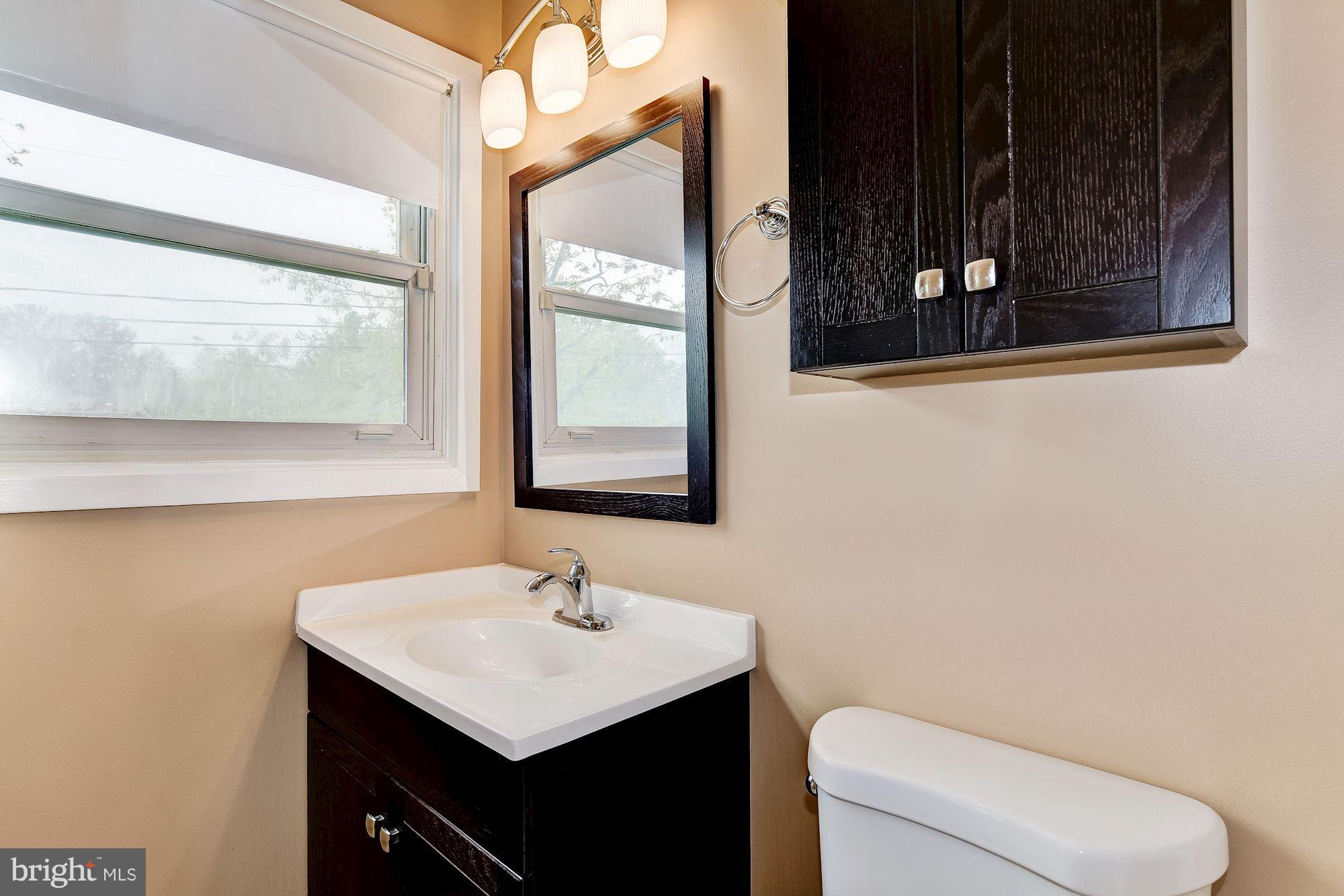 1909 Hanson Road Edgewood, MD 21040 - Photo 19 of 29 a bathroom with a toilet sink and mirror