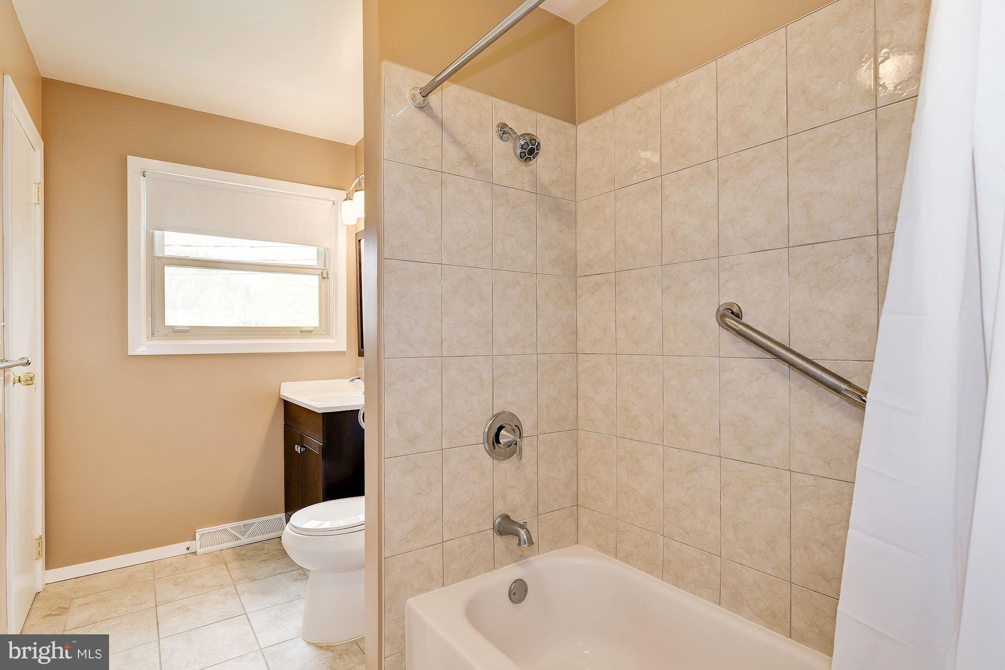 1909 Hanson Road Edgewood, MD 21040 - Photo 20 of 29 a bath room with a toilet a bath tub and a shower