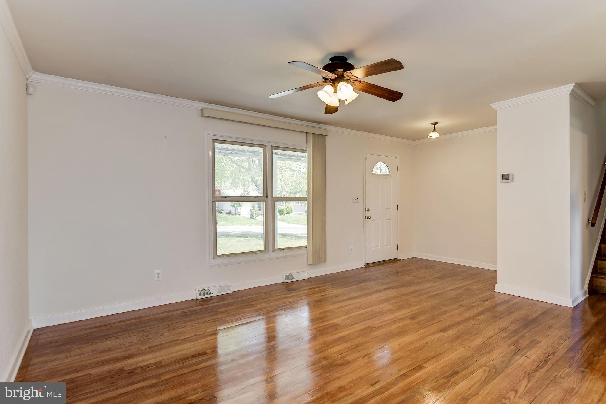 1909 Hanson Road Edgewood, MD 21040 - Photo 5 of 29 a view of an empty room with wooden floor and a window