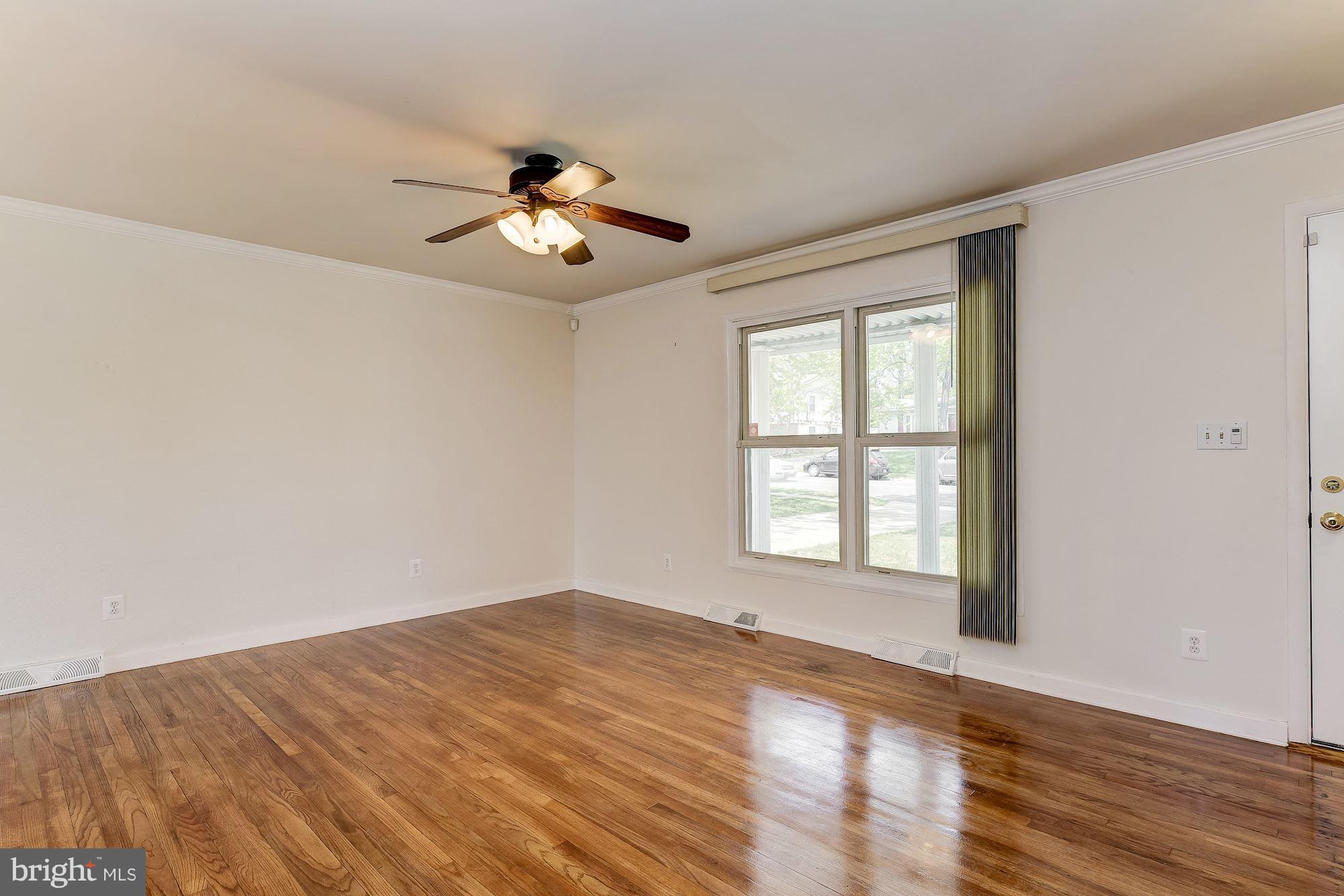 1909 Hanson Road Edgewood, MD 21040 - Photo 6 of 29 a view of empty room with wooden floor and fan