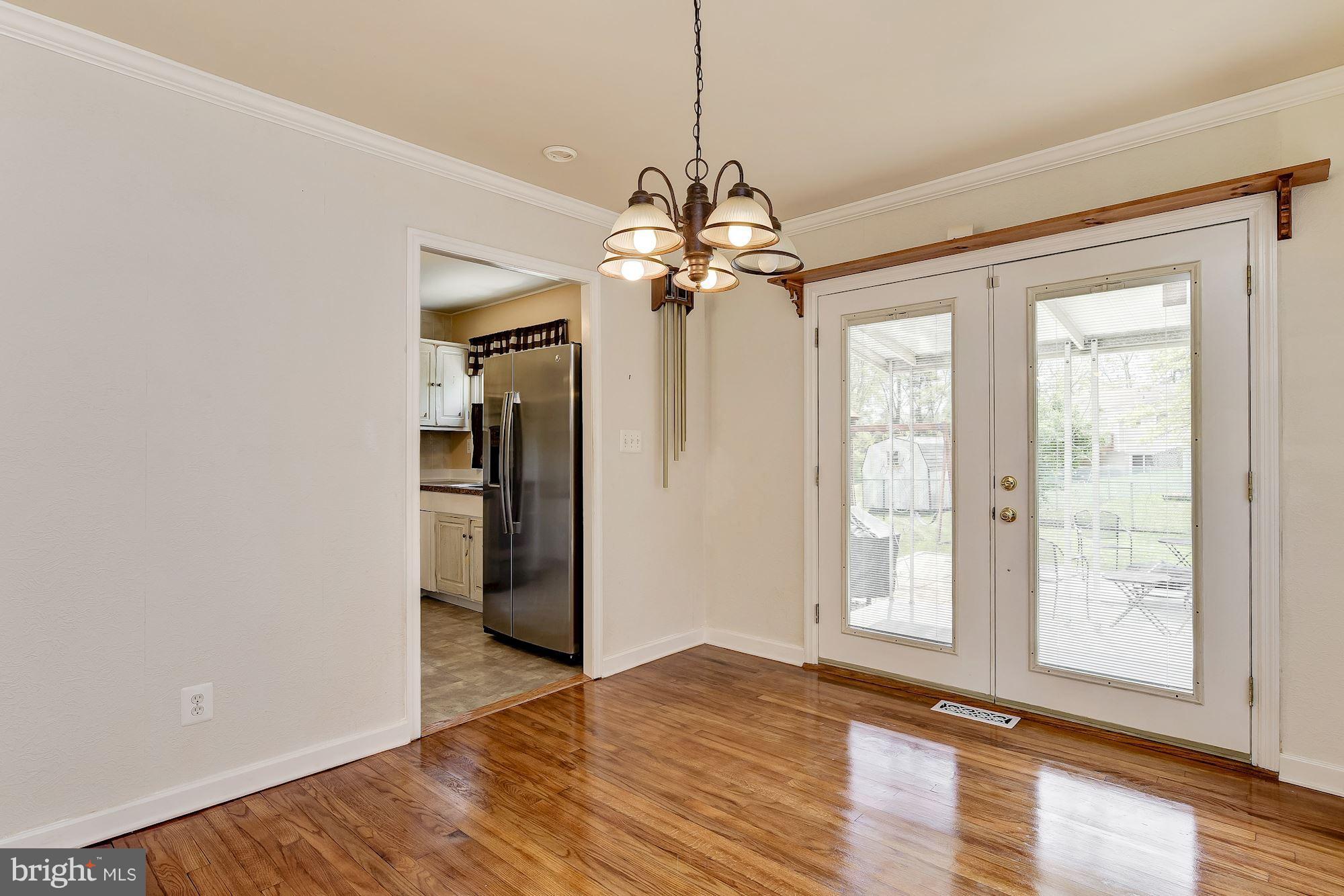 1909 Hanson Road Edgewood, MD 21040 - Photo 8 of 29 a view of an empty room with window and wooden floor