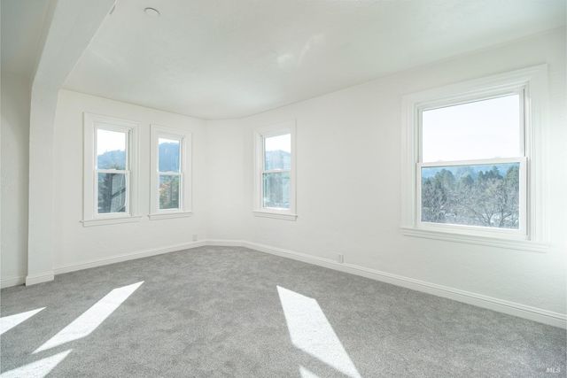 a view of a terrace with a table and chairs