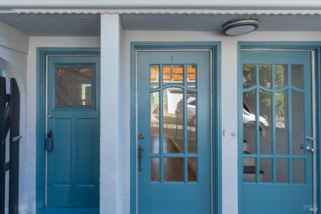 a view of a door and a window