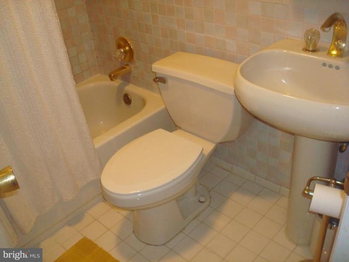5618 Chelwynd Road Halethorpe, MD 21227 - Photo 22 of 26 a bathroom with a toilet and a sink