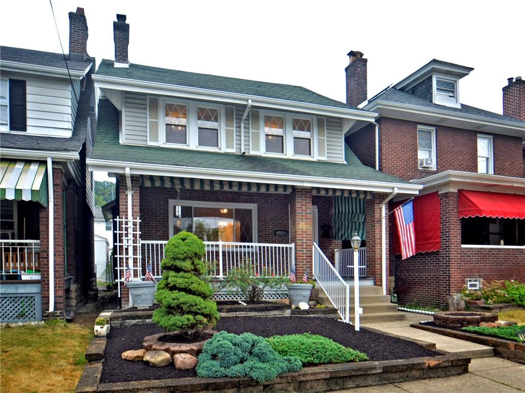 1423 Chislett Street Pittsburgh, PA 15206 - Photo 1 of 47 a front view of a house with garden