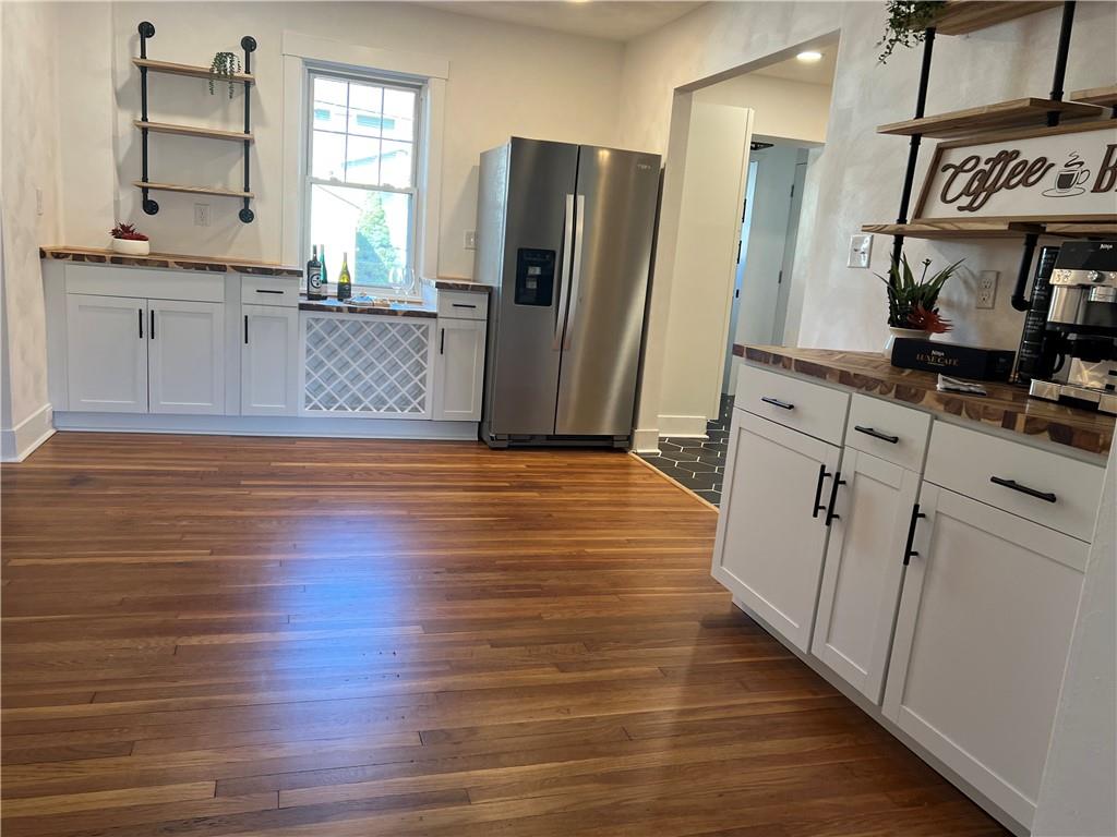 1423 Chislett Street Pittsburgh, PA 15206 - Photo 12 of 47 a kitchen with stainless steel appliances granite countertop a refrigerator and a stove