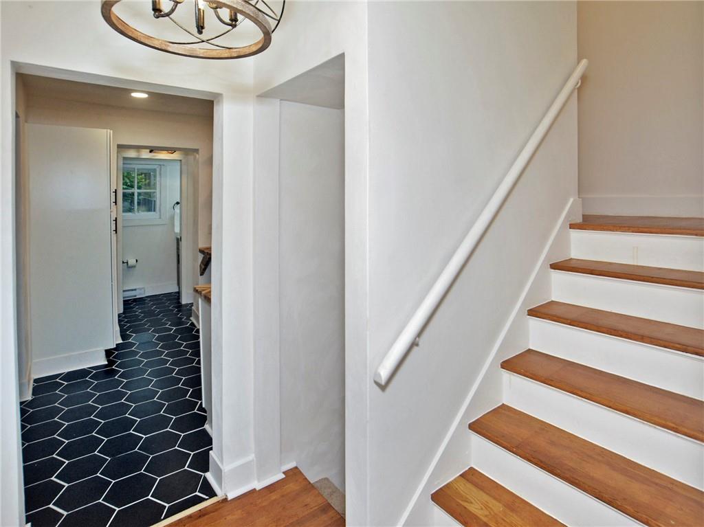 1423 Chislett Street Pittsburgh, PA 15206 - Photo 15 of 47 a view of a hallway with wooden floor and staircase