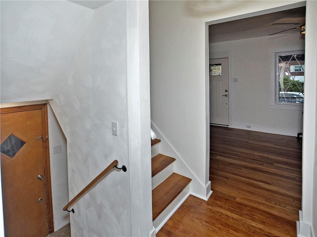 1423 Chislett Street Pittsburgh, PA 15206 - Photo 34 of 47 a view of a hallway with wooden floor and staircase