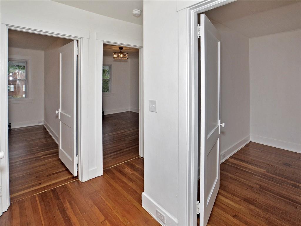 1423 Chislett Street Pittsburgh, PA 15206 - Photo 35 of 47 a view of a hallway with wooden floor and staircase