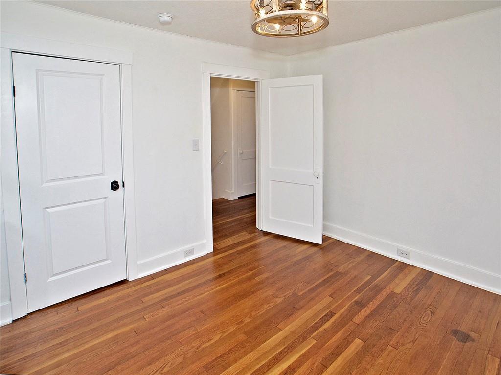 1423 Chislett Street Pittsburgh, PA 15206 - Photo 36 of 47 a view of an empty room with wooden floor