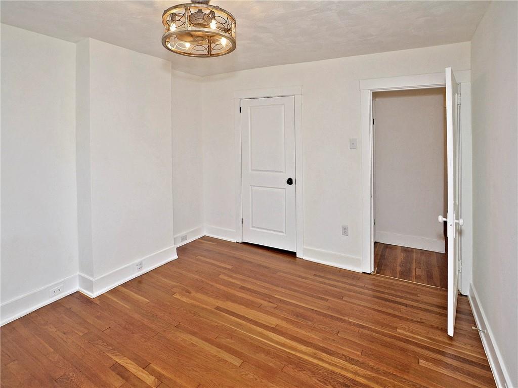 1423 Chislett Street Pittsburgh, PA 15206 - Photo 37 of 47 a view of an empty room with wooden floor